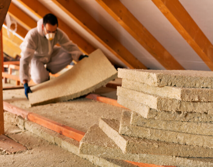 Moisture Barrier: Man laying thermal insulation